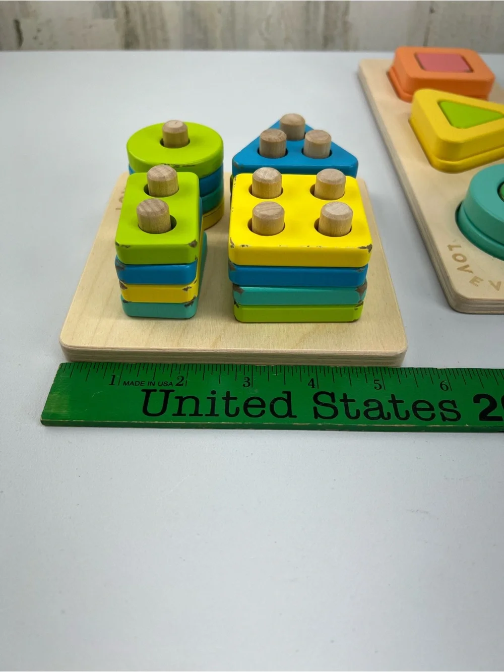 Lovevery Lot of 2 Puzzles Geo Shapes and Sort & Stack Peg Puzzle Montessori Toys